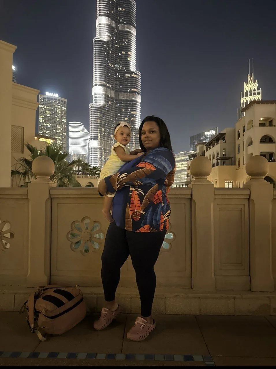 Amia and her baby in front of Dubai’s Burj Khalifa