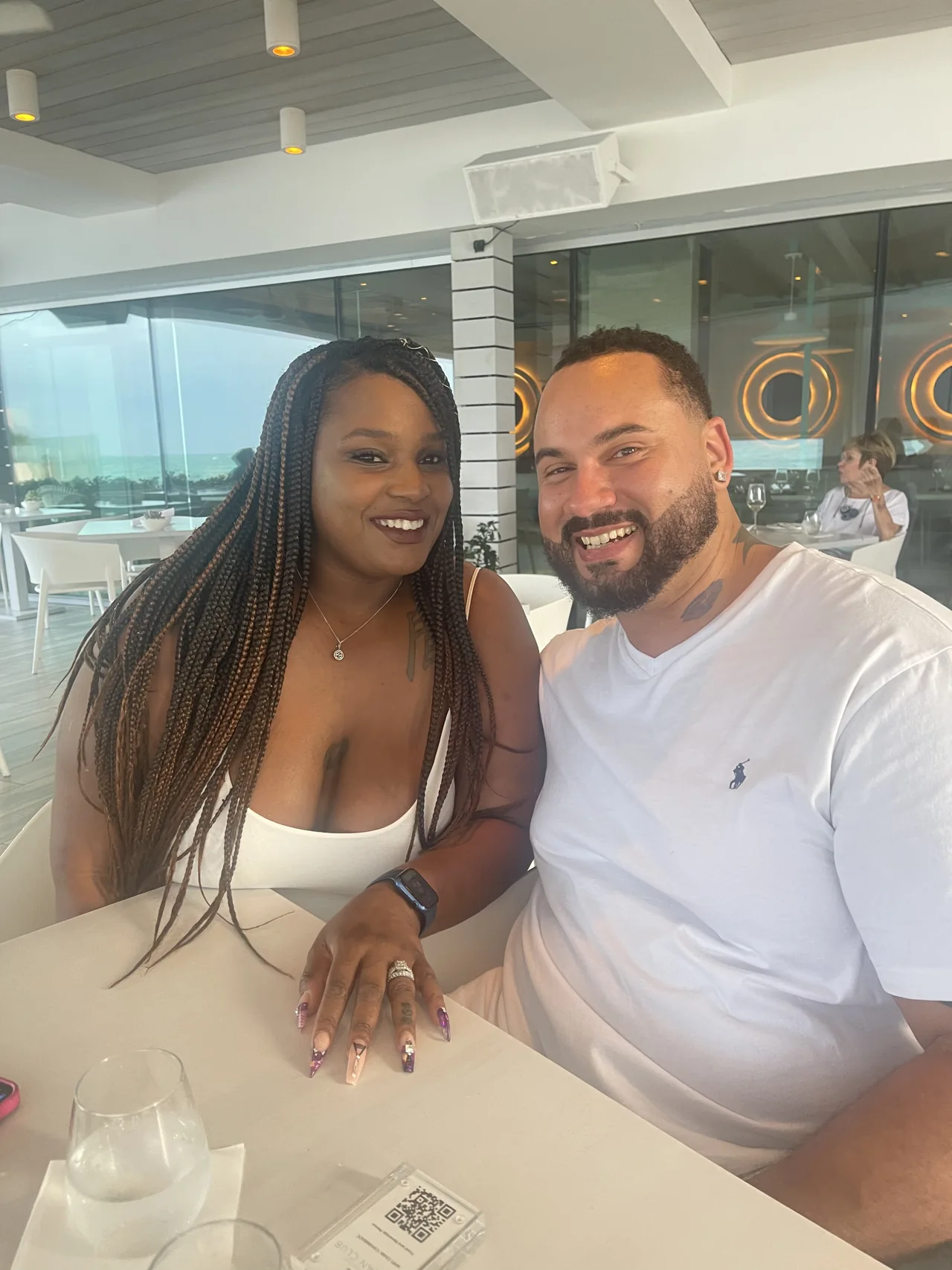 Amia and her husband smiling together